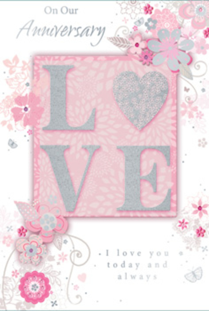 An open anniversary card is shown in close detail, its artwork evoking the calm romance of an early spring walk through Finsbury Park. At the heart of the design sits the word LOVE, each capital letter raised slightly from the surface and edged with a dusting of fine, frosted glitter. The letters glow in a mixture of blush pink and soft pearl, with tiny silvery highlights that catch the light much like the sheen on satin ribbon tied around a hand-crafted bouquet. This central word rests on a deeper blush-pink panel, subtly framed, giving it the presence of a cherished photo on a mantelpiece. Around it, delicate, hand-drawn blooms and winding leaves spill gently into the borders, their petals traced in pinks, whites, and muted greys. Some shapes recall petite roses, others airy blossoms you might spot in a florist's window on Blackstock Road, all stylised yet unmistakably floral. Fine filigree swirls and tiny leaves weave between the flowers, adding movement and grace, while faint, almost hidden butterflies seem to hover among the petals, suggesting fluttering hearts and soft anniversaries shared over many years. The background remains a soft, powdery pink, lending warmth to the entire composition. In elegant, understated script, a loving anniversary message and phrases like I love you today and always are written with the ease of long-standing affection. The overall feel is of a card that is both tender and refined, like a hand-tied arrangement chosen with care and delivered to a favourite home just off Seven Sisters Road to mark a very special shared milestone.