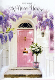 This sunlit entryway could easily belong to a freshly painted home on a peaceful street just off Finsbury Park, where neighbours pause to admire a particularly beautiful doorstep. A blush-pink front door forms the focal point, its soft tone radiating warmth and quiet joy against a backdrop of whitewashed walls. Above and to the side, cascades of lavender wisteria trail in graceful arcs, their tiny clustered blooms creating a dreamy canopy that suggests both fragrance and movement, as if a light breeze might set them gently swaying. The paint on the door and the subtle texture of the wall catch the afternoon light, creating a pattern of soft, painterly shadows that deepen the scene's sense of calm. Resting neatly on the step is a vintage-style grey metal bucket brimming with lush white and cream roses. Each rose is fully open, petals layered like delicate ruffles, surrounded by sprigs of muted green foliage that spill out just enough to feel generous but never untidy. A narrow pink ribbon encircles the bucket and is tied into a simple bow, its ends trailing onto the stone step, pulling together the pinks of the ribbon, door, and distant shutter. It's the kind of thoughtfully finished arrangement you might have delivered to celebrate someone's first flat near Stroud Green Road or a family's move closer to the park. The overall atmosphere is one of tenderness and optimism, a quietly jubilant snapshot of arrival, where every flower and brushstroke whispers, welcome home.